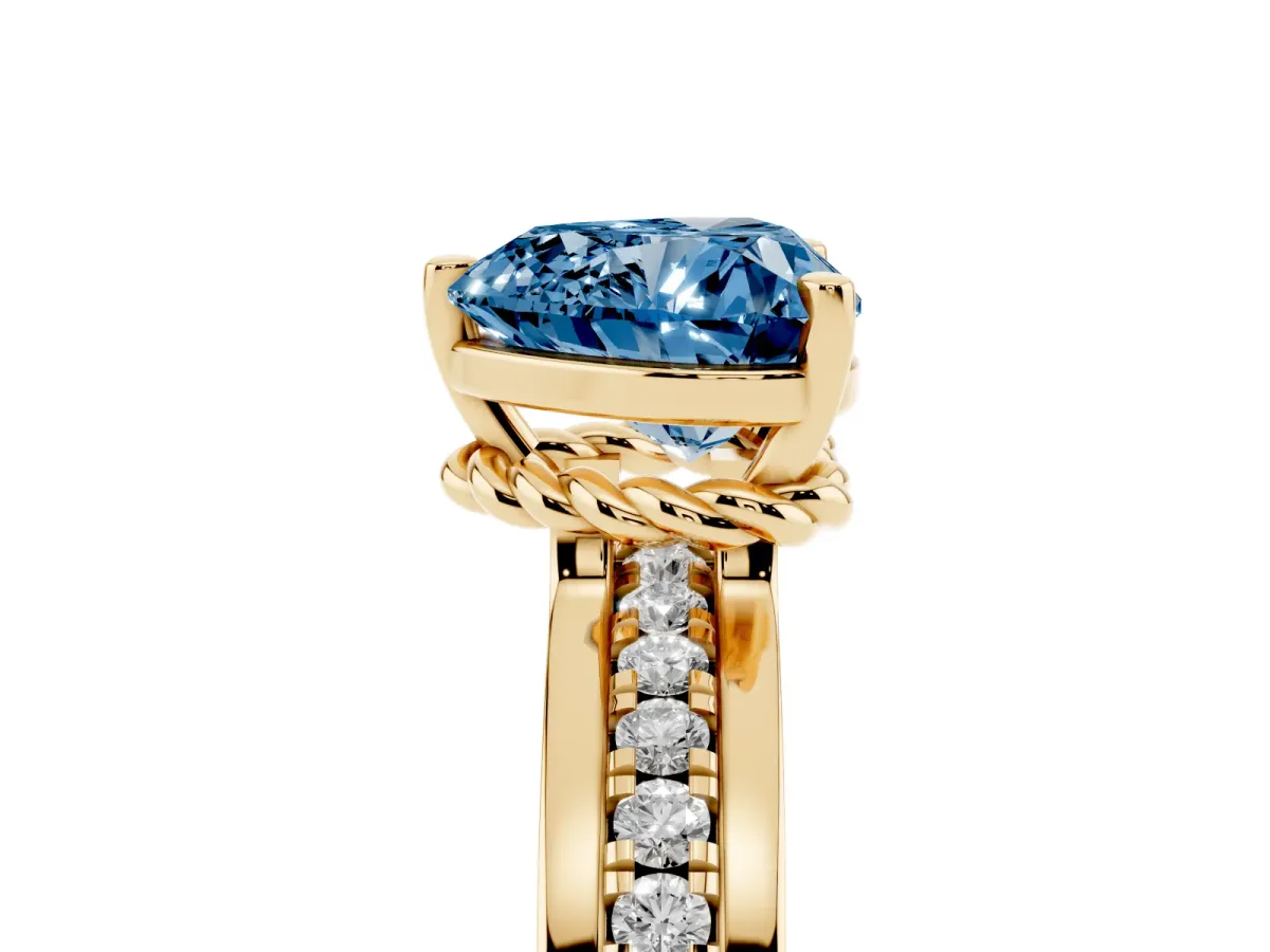 Fancy Blue Heart Cut Solitaire Diamond Ring with Channel Set Band and Six-Prong Setting Yellow gold