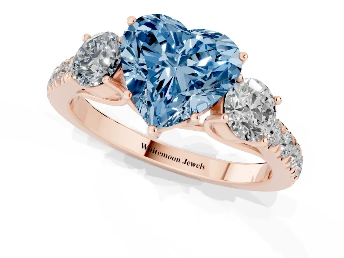 Fancy Blue Heart Cut Cut Diamond Three-Stone Ring with Round Side Stones and Pavé Band Rose gold