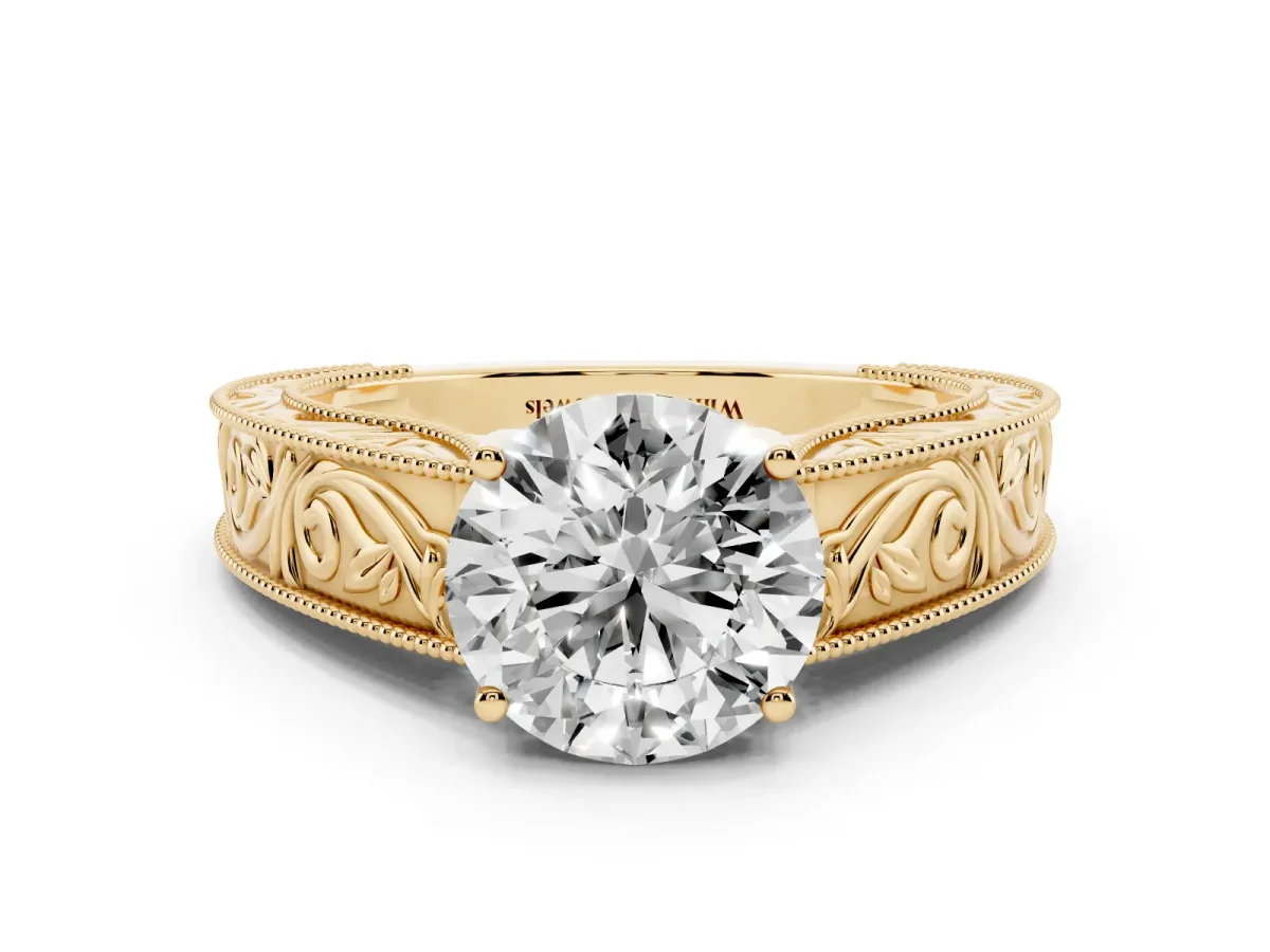 Round Cut Diamond Solitaire Ring with Engraved Band and Four-Prong Setting Yellow gold