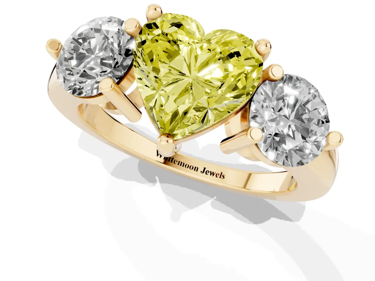 Fancy Yellow Three-Stone Heart Cut Brilliant Cut Solitaire Ring with Prong Setting on a Classic Band Yellow gold