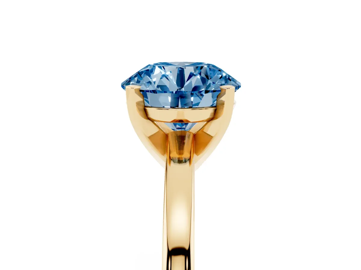 Fancy Blue Round Cut Solitaire Diamond Engagement Ring with Four-Prong Setting on a Classic Band Yellow gold