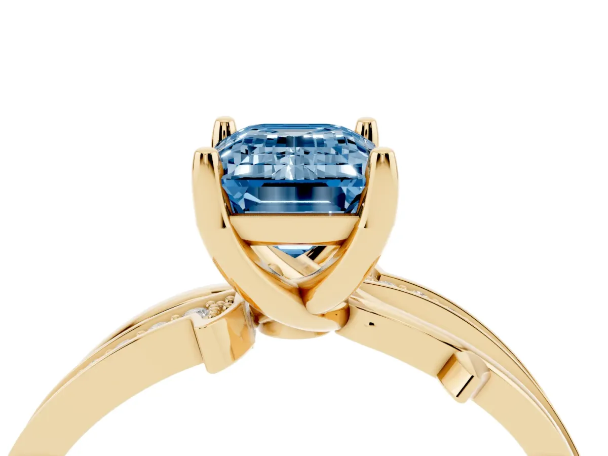 Fancy Blue Emerald Cut Solitaire Twist Band with Pavé Accents and Four-Prong Setting Yellow gold