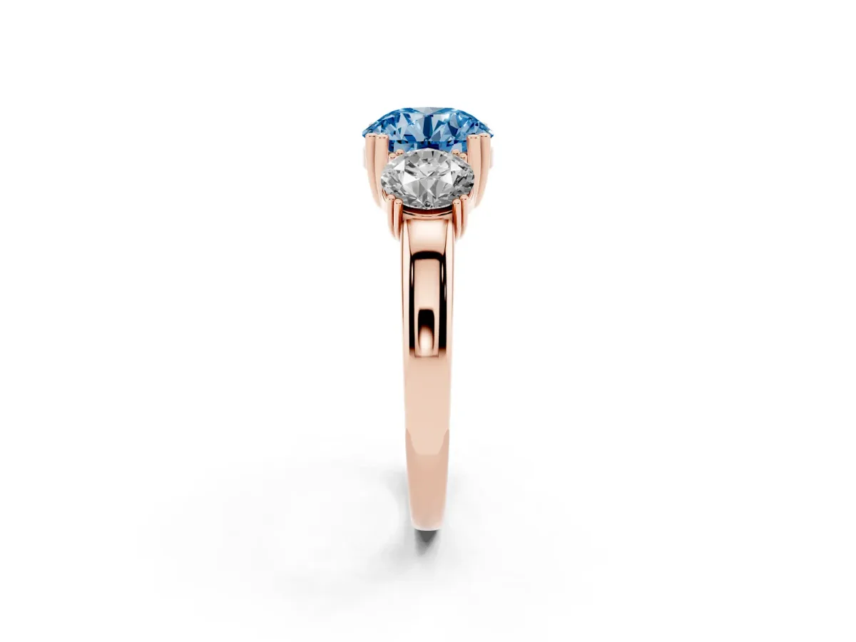 Fancy Blue Three-Stone Round Cut Cut Diamond Ring with Channel Set Band and Four-Prong Setting Rose gold