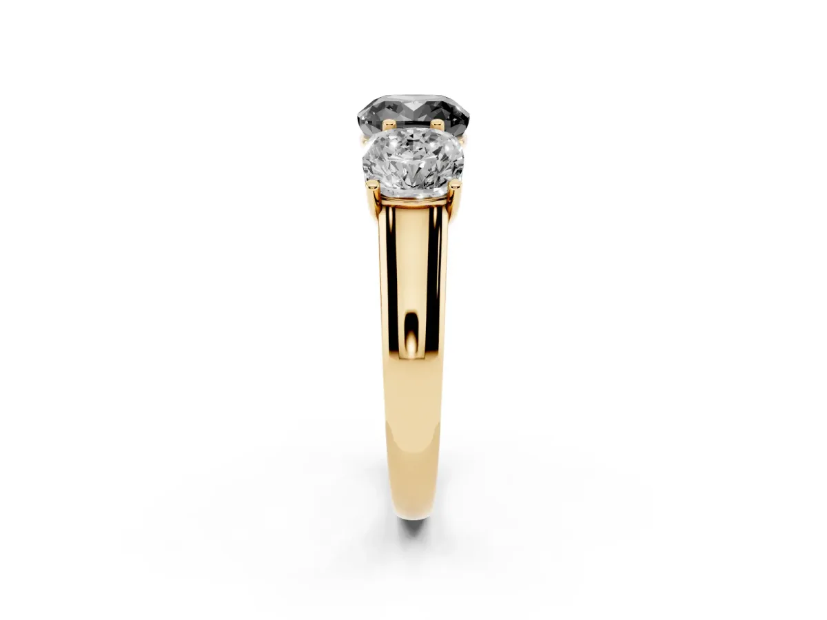 Fancy Black Cushion Cut Three-Stone Diamond Ring with Prong Setting on a Classic Band Yellow gold