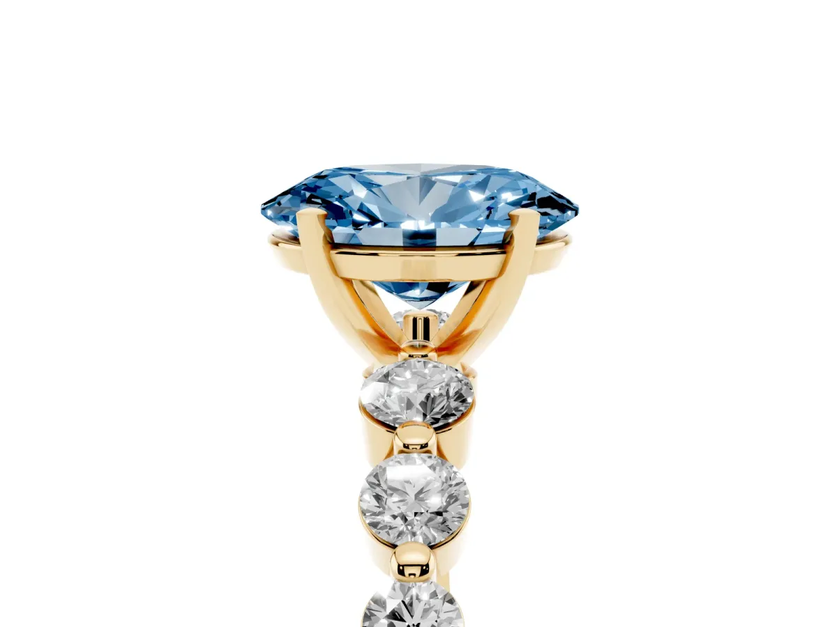 Fancy Blue Oval Cut Solitaire Diamond Ring with Pave Band and Four-Prong Setting Yellow gold