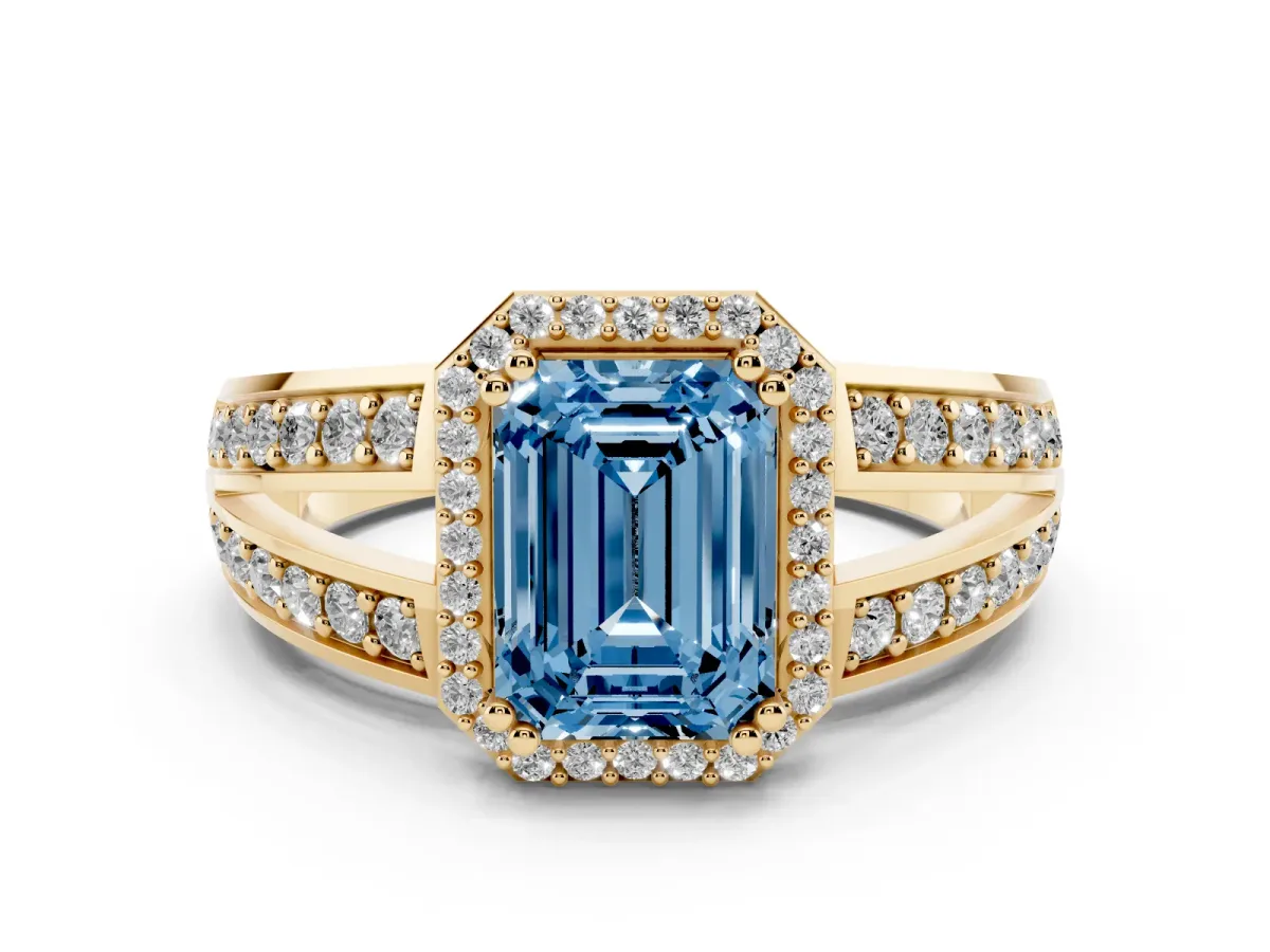 Fancy Blue Emerald Cut Diamond Halo Ring with Split Shank Pavé Band and Four-Prong Setting Yellow gold