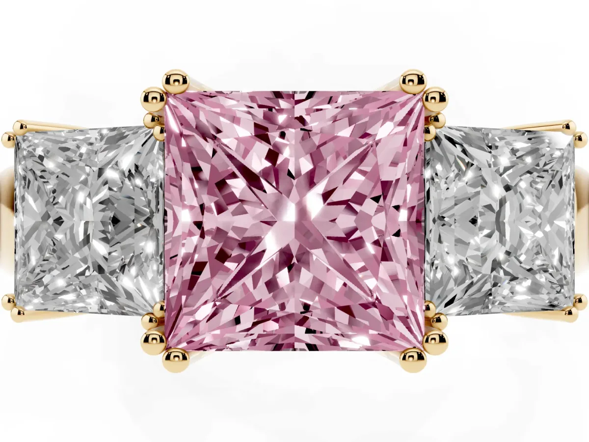 Fancy Pink Three-Stone Princess Cut Cut Diamond Ring with Channel Set Band and Four-Prong Setting Yellow gold