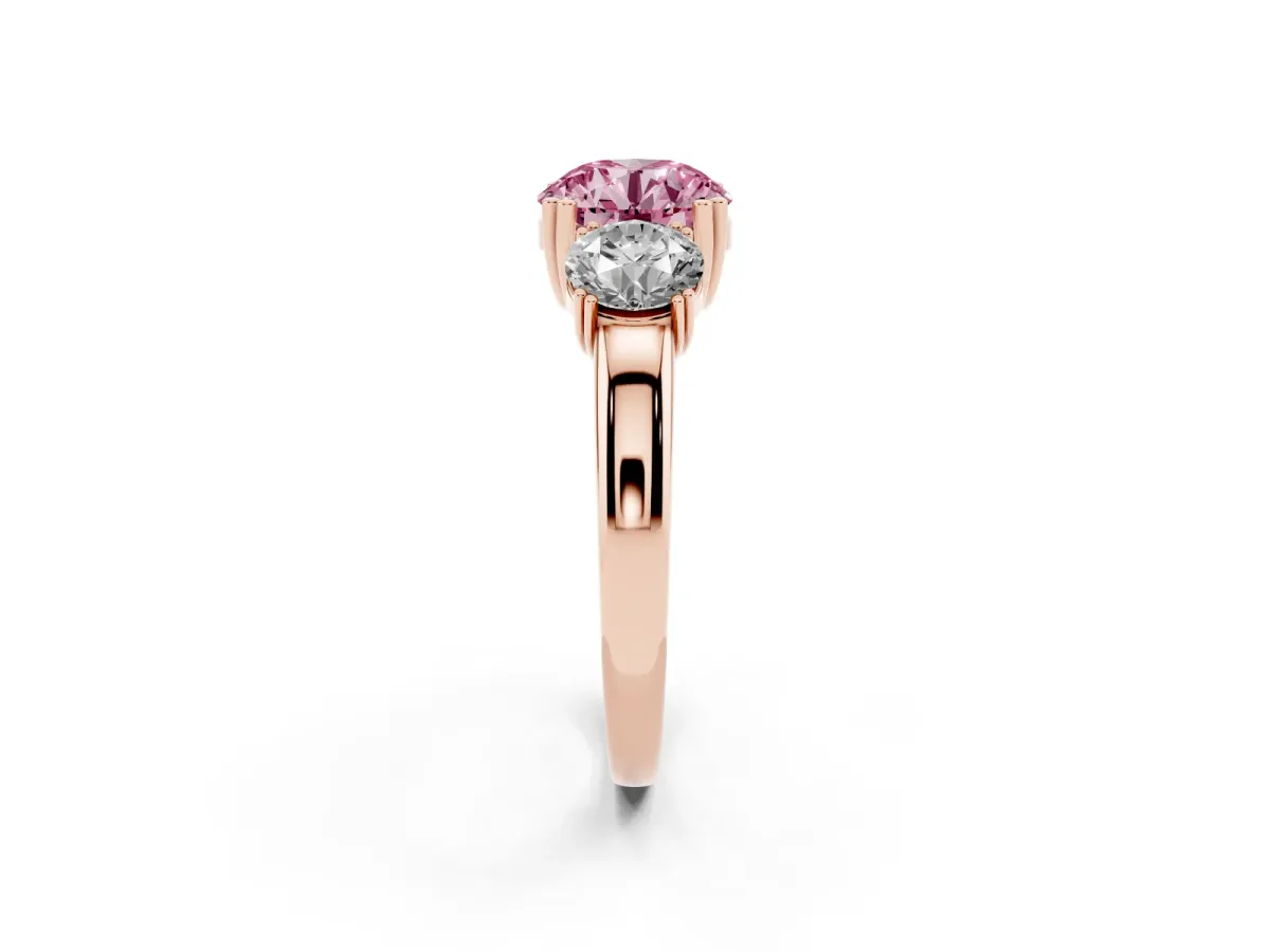 Fancy Pink Three-Stone Round Cut Cut Diamond Ring with Channel Set Band and Four-Prong Setting Rose gold