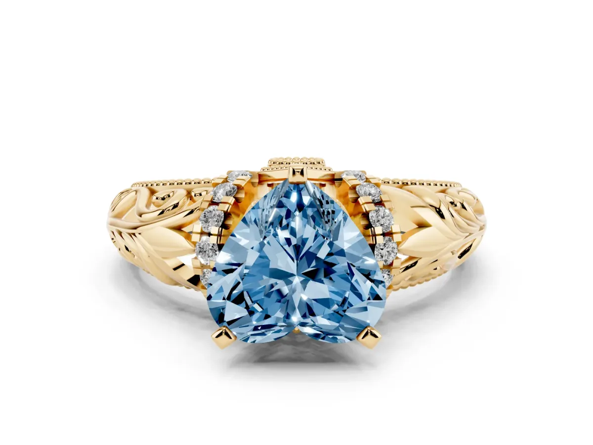 Fancy Blue Heart Cut Solitaire Filigree Engagement Ring with Halo and Prong Setting Yellow gold