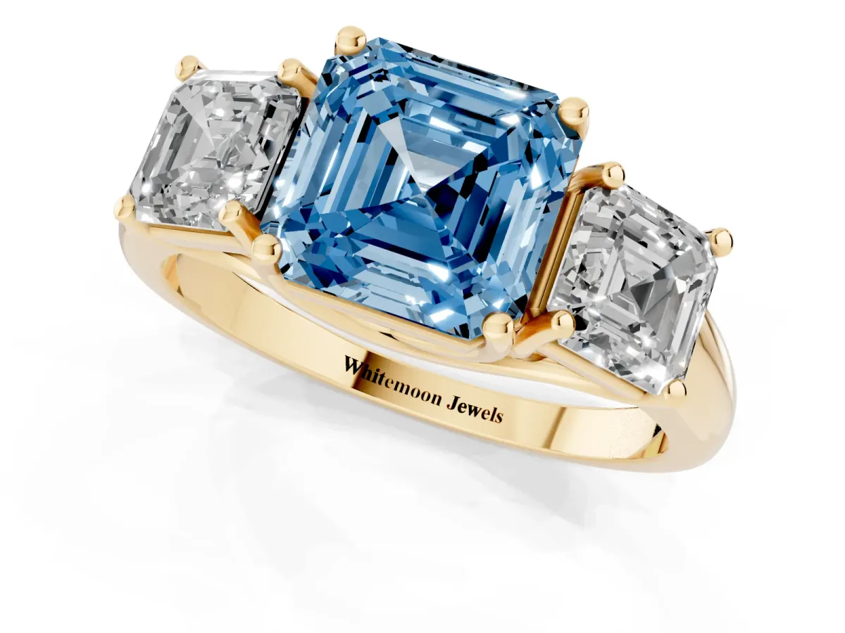 Fancy Blue Three-Stone Asscher Cut Diamond Engagement Ring with Prong Setting Yellow gold