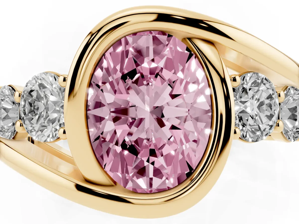 Fancy Pink Bezel Set Oval Cut Diamond Bypass Ring with Round Accents Yellow gold