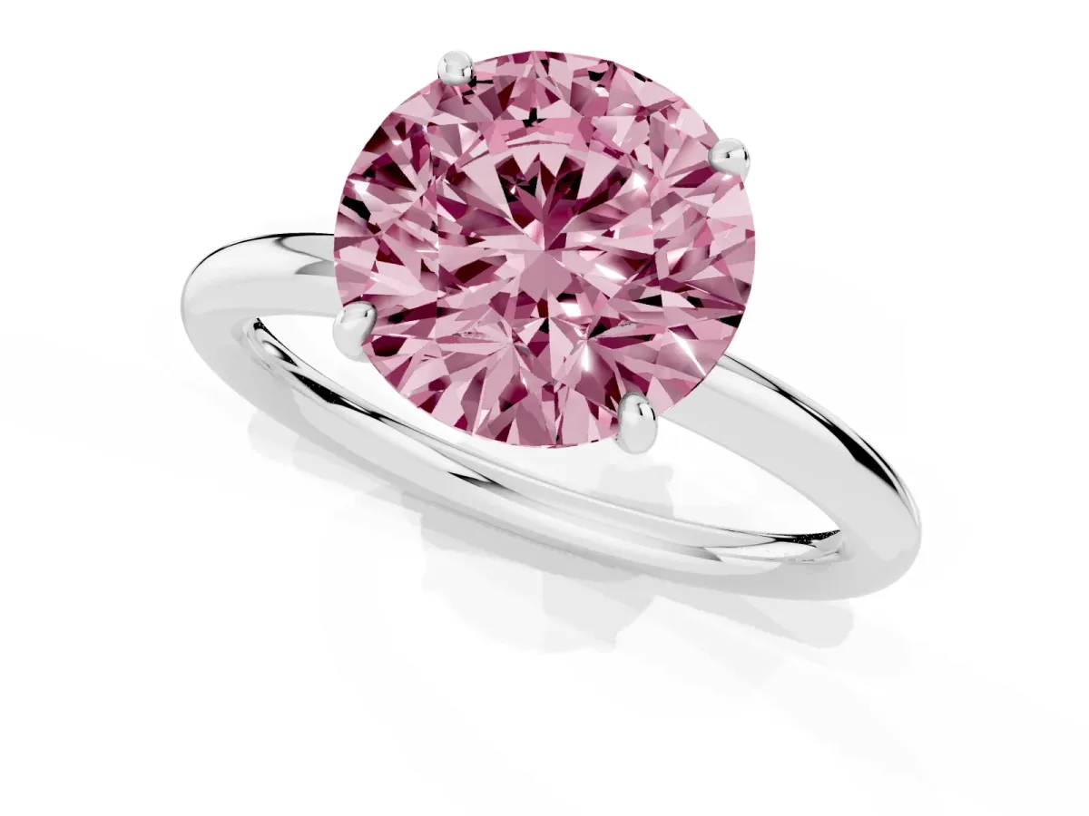 Fancy Pink Round Cut Solitaire Diamond Ring with Four-Prong Setting on a Plain Band Platinum