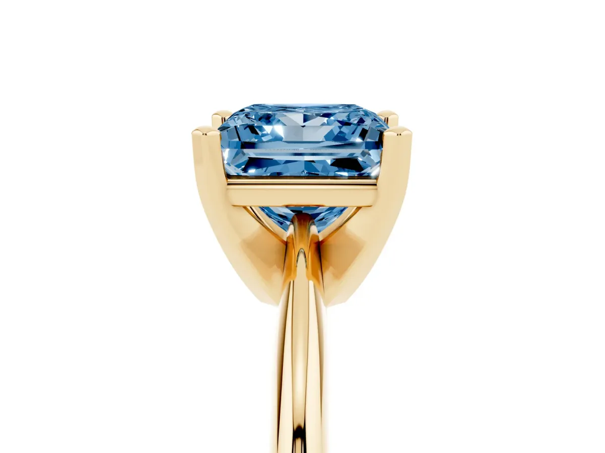 Fancy Blue Princess Cut Cut Solitaire Ring with Four-Prong Setting on a Classic Band Yellow gold