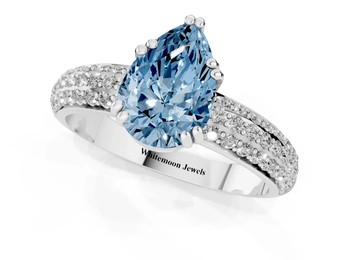 Fancy Blue Pear Cut Diamond Solitaire Ring with Multi-Row Round Pavé Band and Prong Setting Silver