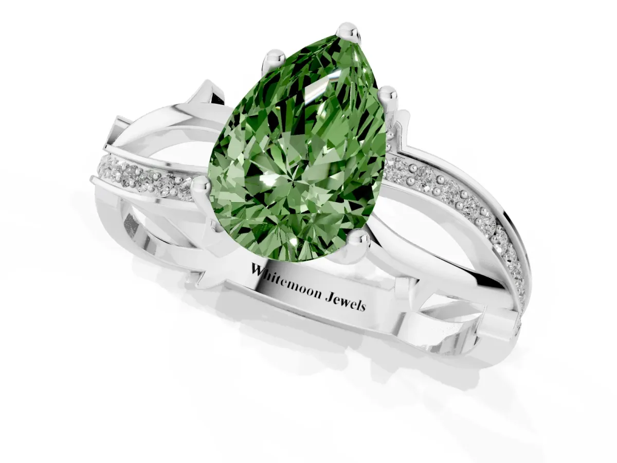 Fancy Green Pear Cut Solitaire Twist Band with Pavé Accents and Four-Prong Setting Silver