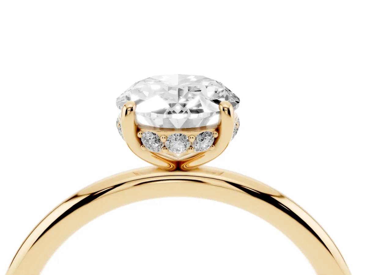 Oval Cut Solitaire Diamond Ring with a Classic Band and Four-Prong Setting Yellow gold