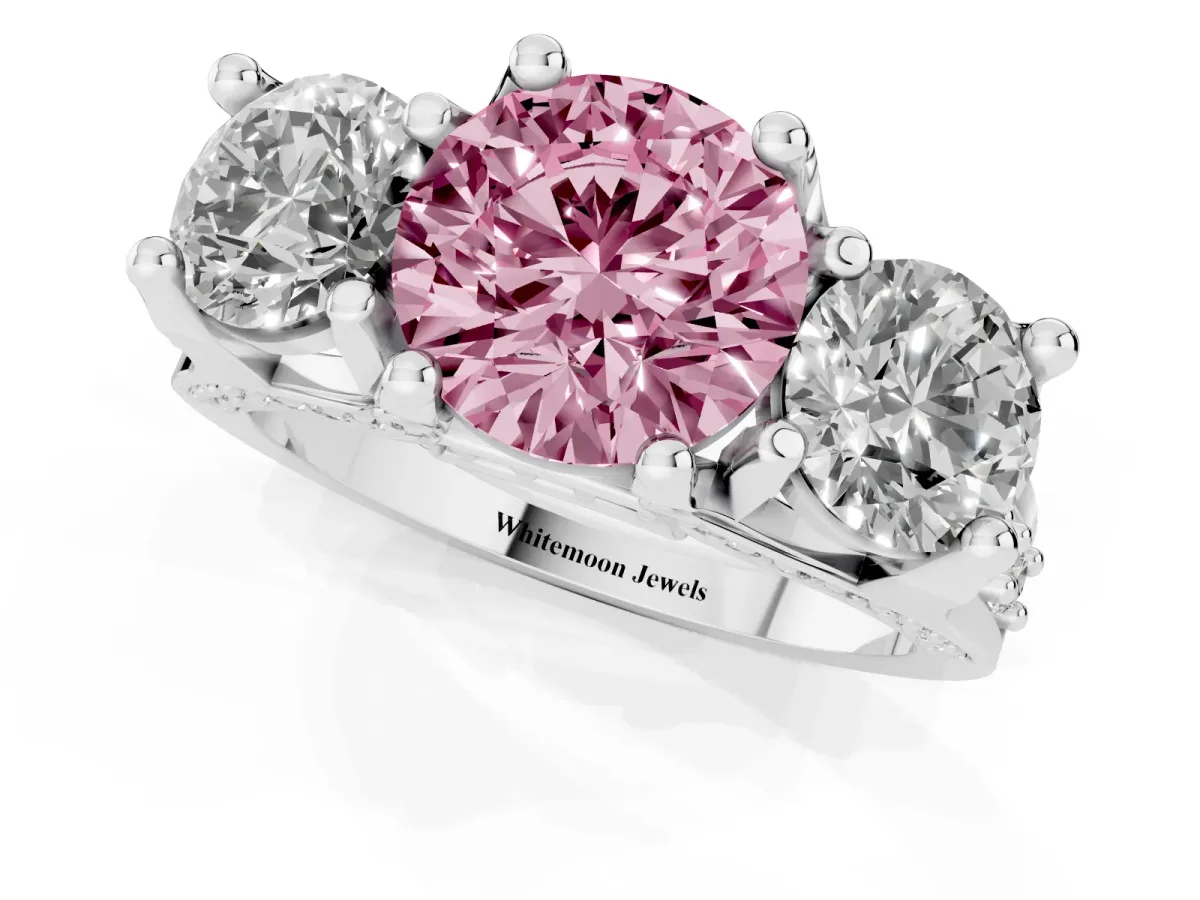 Fancy Pink Round Cut Diamond Three-Stone Ring with Channel Set Band and Four-Prong Setting Silver