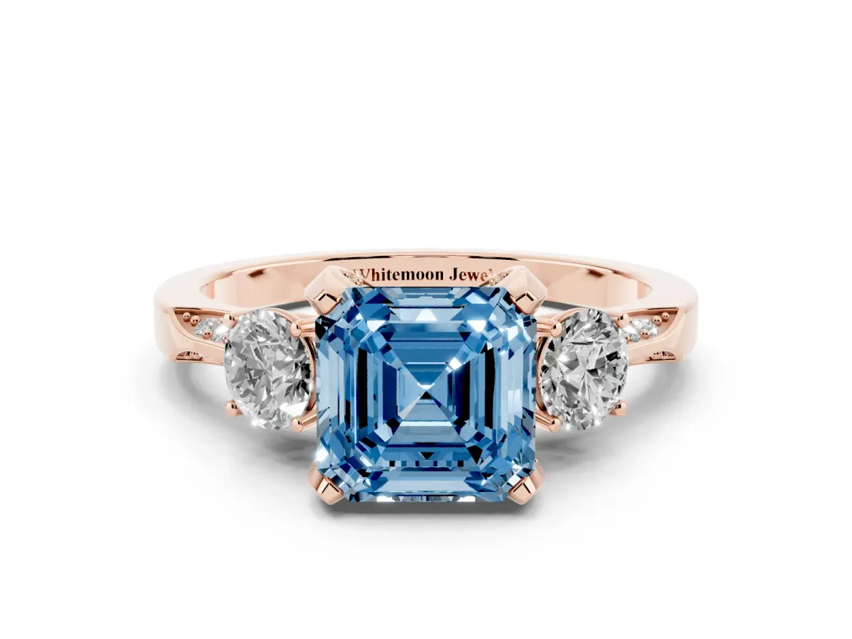 Fancy Blue Asscher Cut Brilliant Three-Stone Diamond Ring with Pavé Band and Four-Prong Setting Rose gold