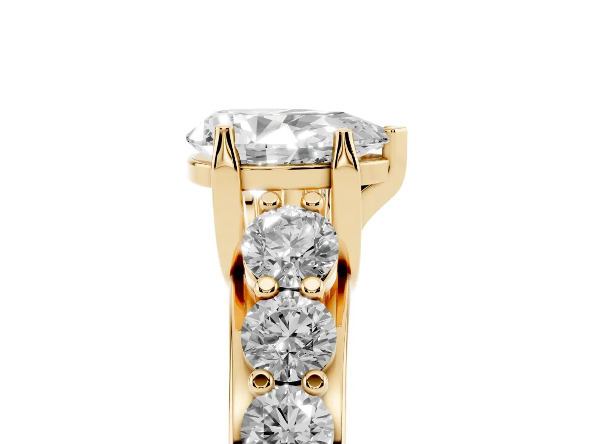 Pear Cut Diamond Engagement Ring with Pavé Band and Four-Prong Setting Yellow gold