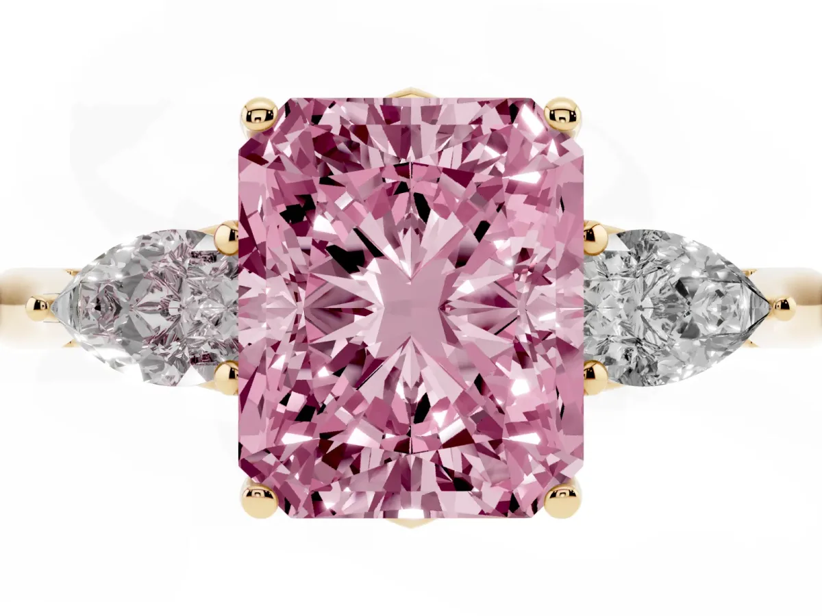 Fancy Pink Three-Stone Radiant Cut Diamond Ring with Pear Side Stones in Four-Prong Setting Yellow gold