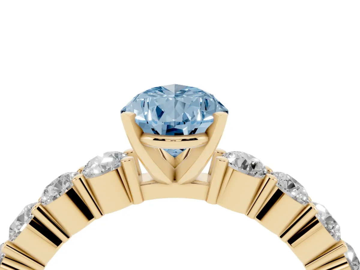 Fancy Blue Pear Cut Diamond Solitaire Ring with Shared Prong Round Side Stones Yellow gold
