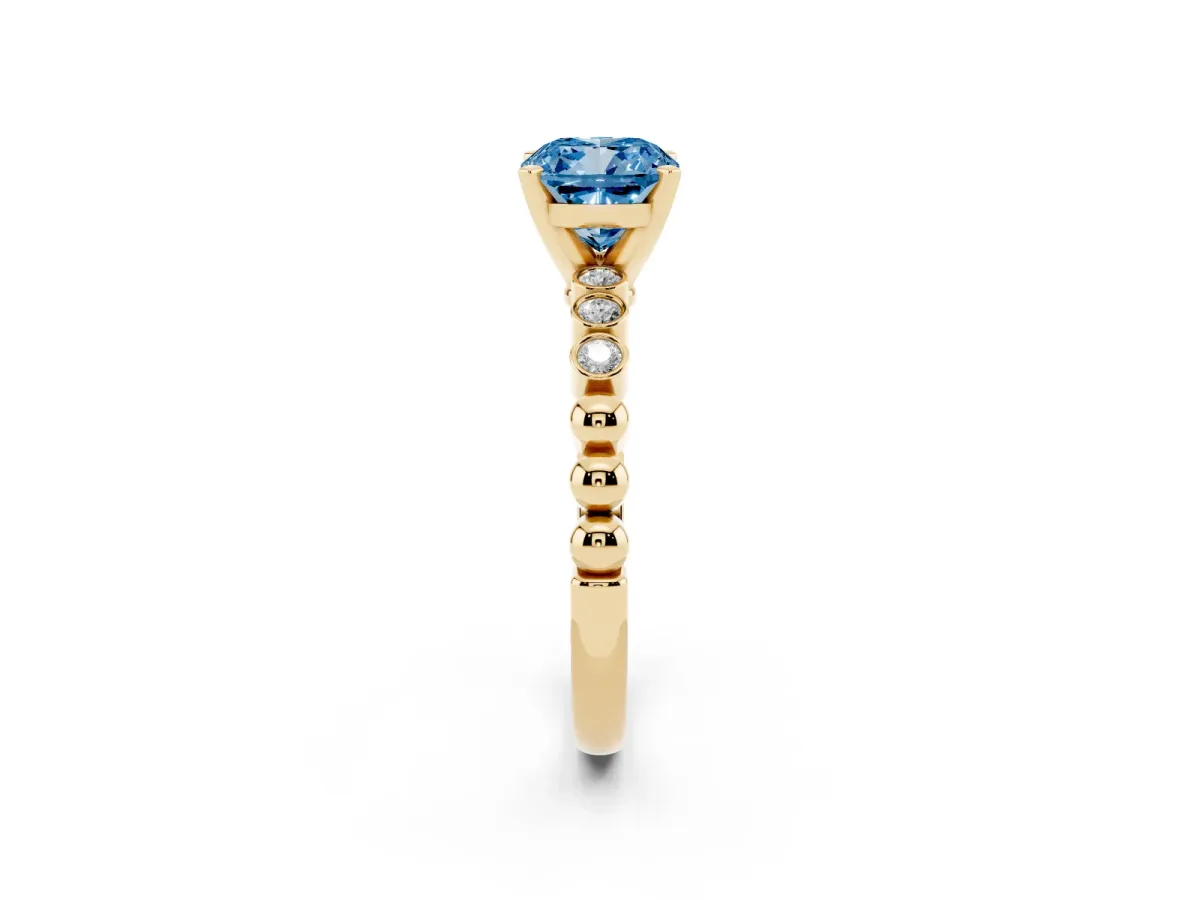 Fancy Blue Cushion Cut Solitaire Bezel Accent Diamond Engagement Ring with Beaded Band and Four-Prong Setting Yellow gold