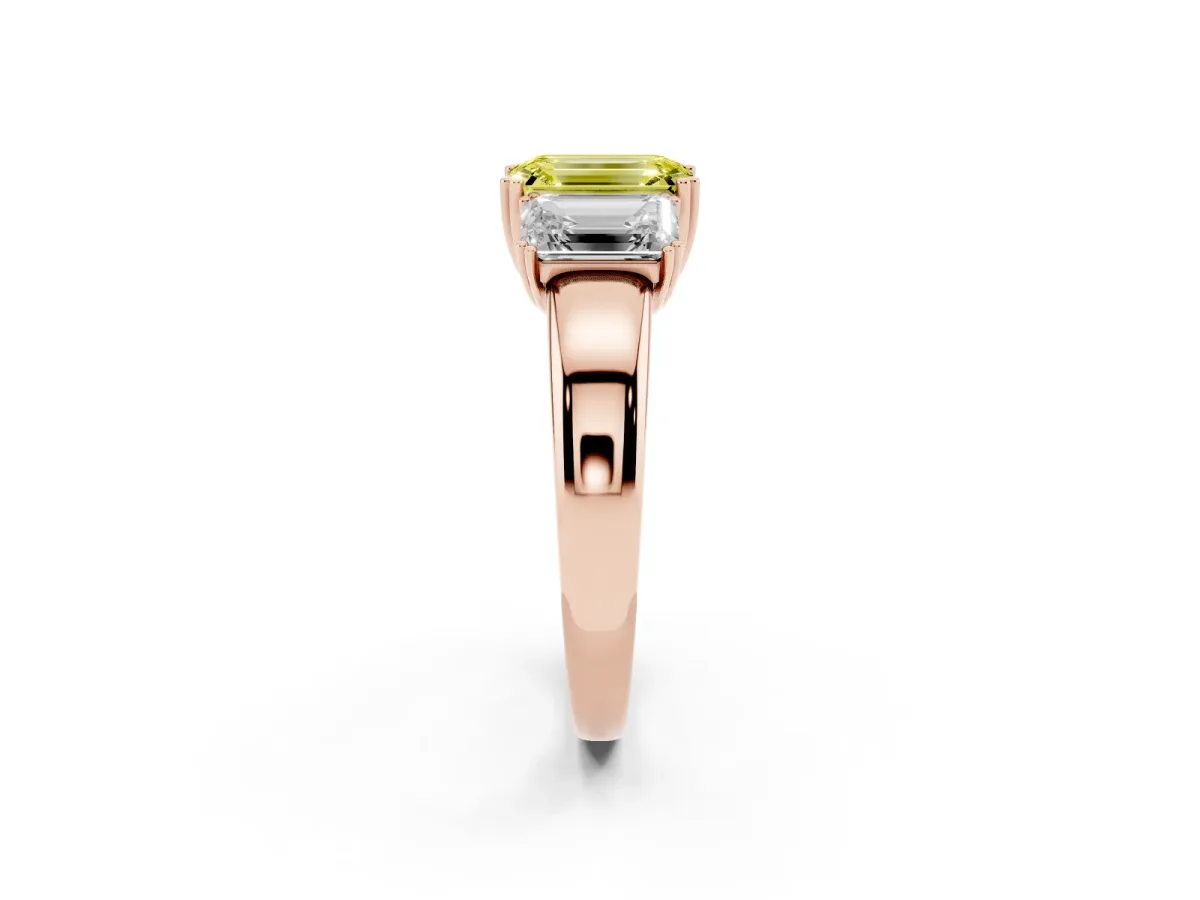 Fancy Yellow Three-Stone Emerald Cut Cut Diamond Ring with Channel Set Band and Four-Prong Setting Rose gold