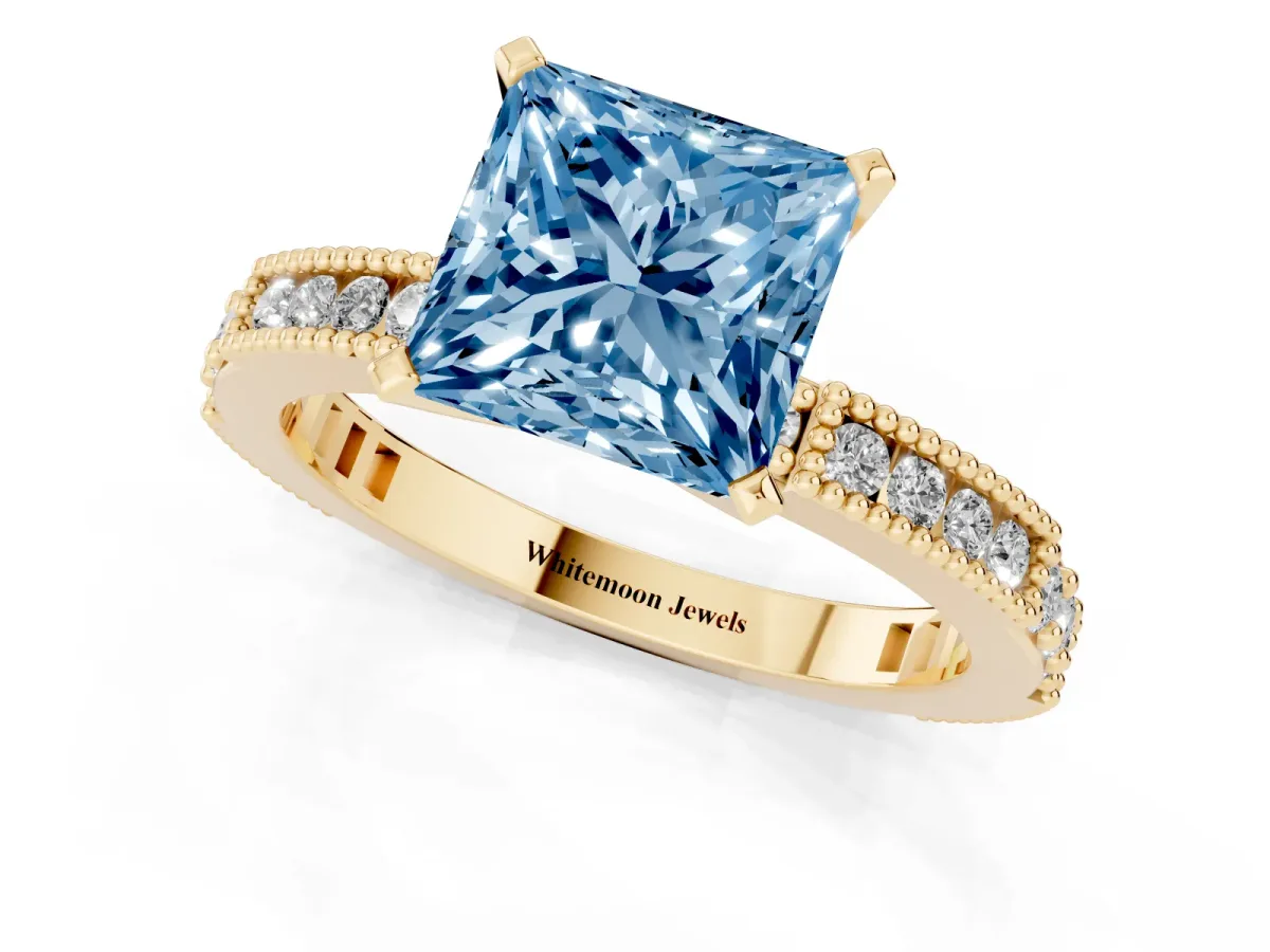 Fancy Blue Princess Cut Solitaire with Pavé Band and Four-Prong Setting Yellow gold