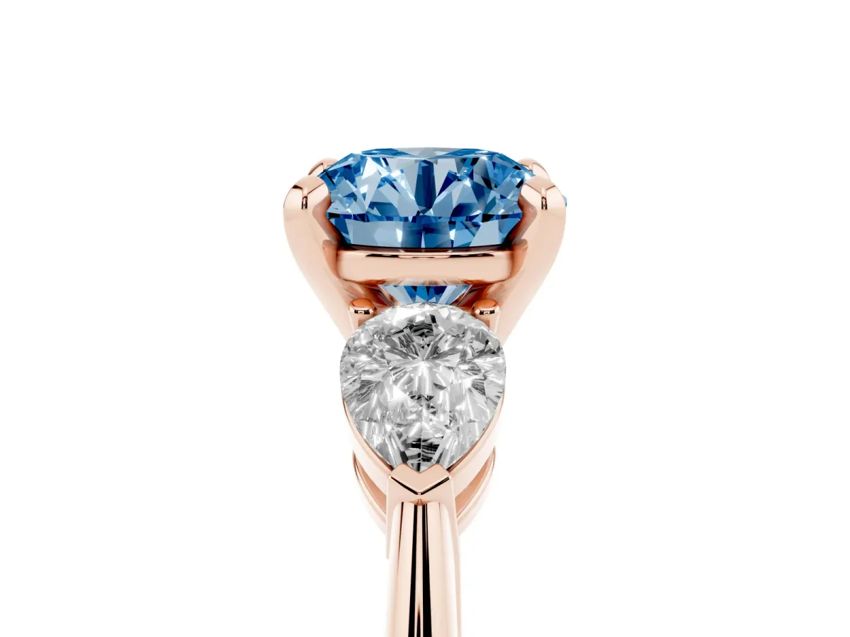 Fancy Blue Three-Stone Round Cut Diamond Ring with Pear Side Stones and Four-Prong Setting Rose gold