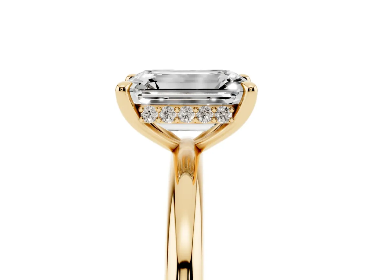 Emerald Cut Diamond Solitaire Ring with Thin Band and Four-Prong Setting Yellow gold