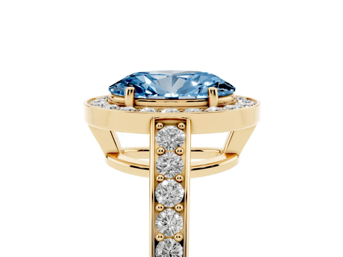 Fancy Blue Oval Cut Halo Pavé Diamond Engagement Ring with Bezel Setting Yellow gold