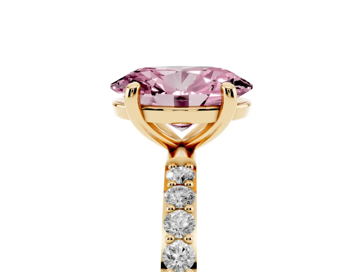 Fancy Pink Oval Cut Diamond Solitaire Ring with Round Pavé Band and Prong Setting Yellow gold
