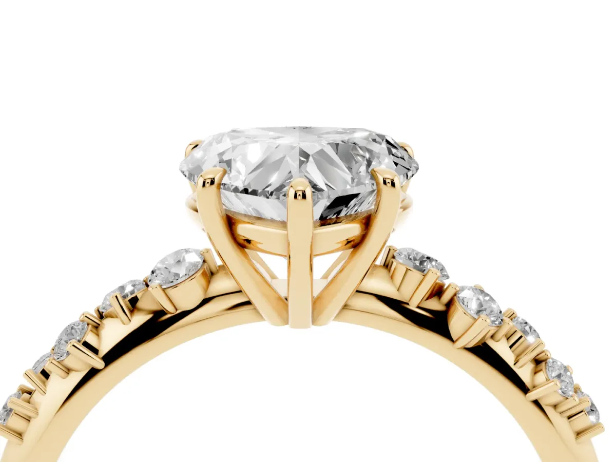 Heart Cut Diamond Cluster Side Stone Solitaire Ring with Prong Setting Yellow gold
