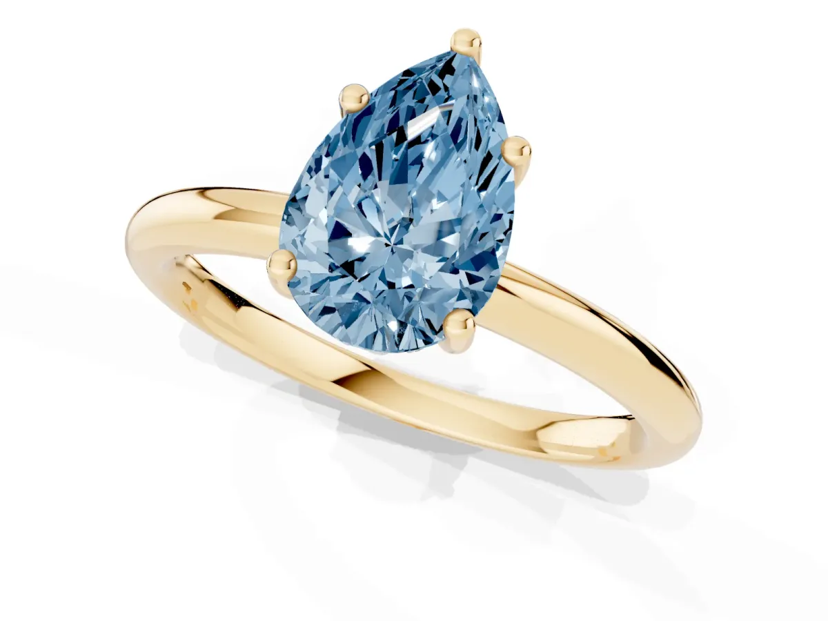 Fancy Blue Pear Cut Cut Solitaire Engagement Ring with Four-Prong Setting and Classic Band Yellow gold