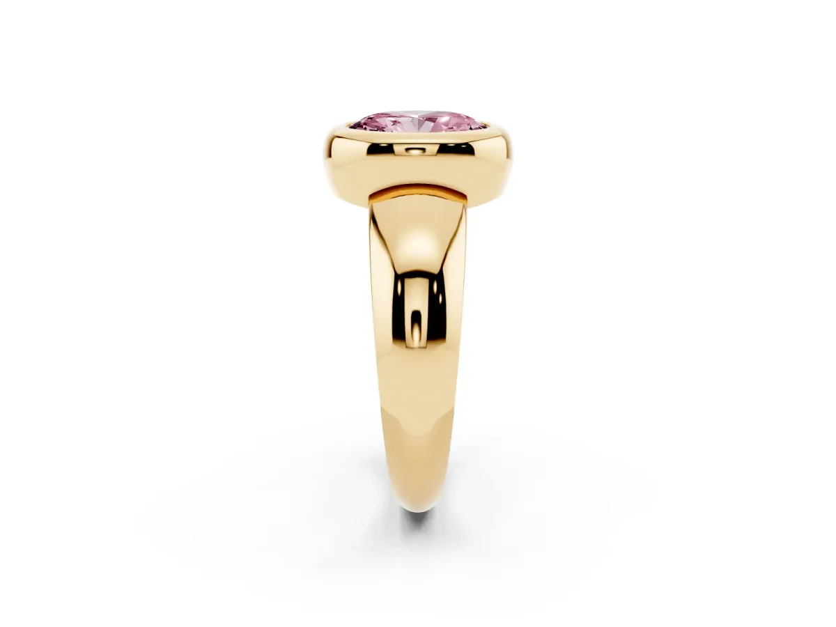 Fancy Pink Bezel Set Oval Cut Solitaire Ring with Wide Band Yellow gold