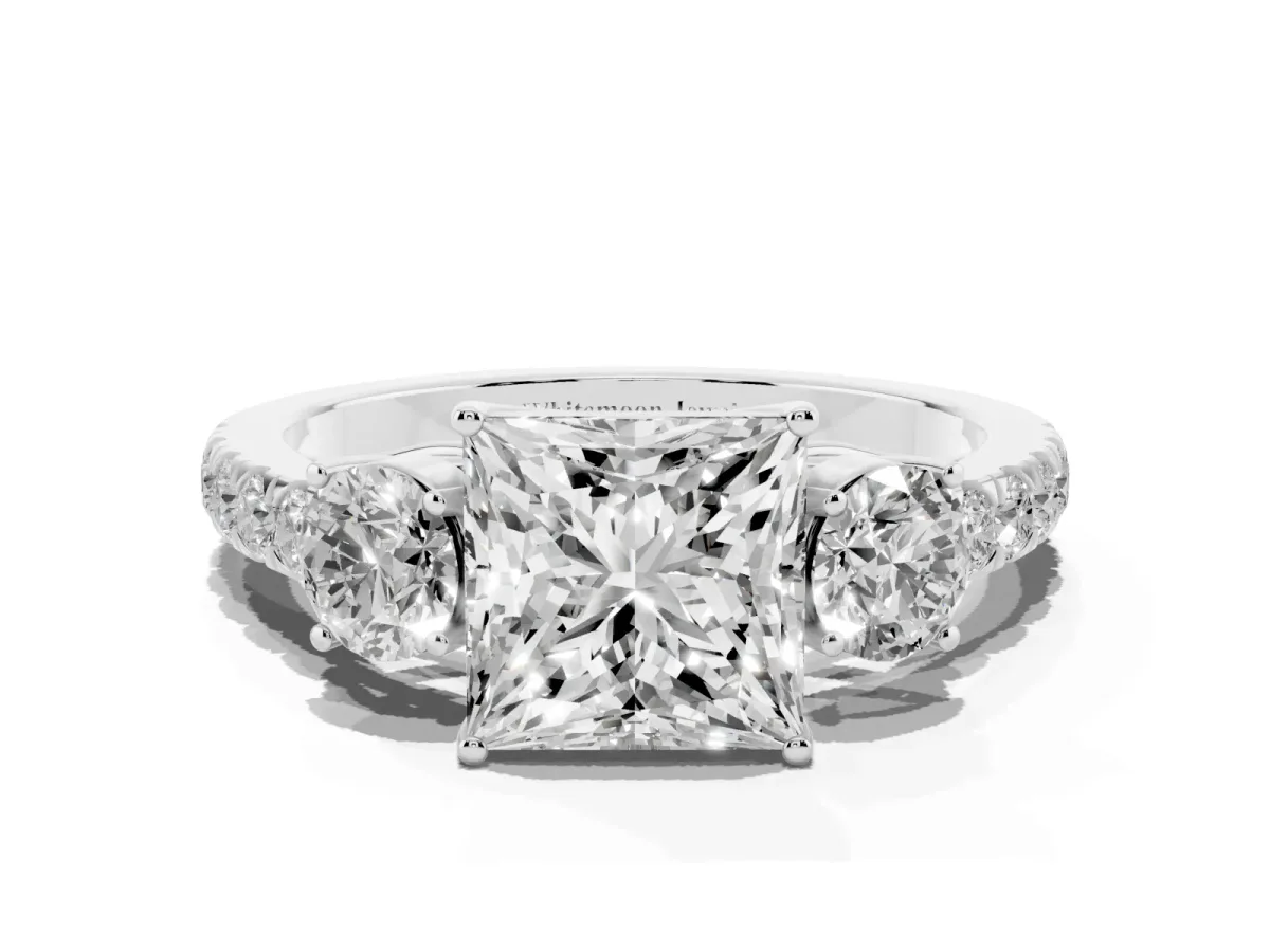 Princess Cut Cut Diamond Three-Stone Ring with Round Side Stones and Pavé Band Platinum