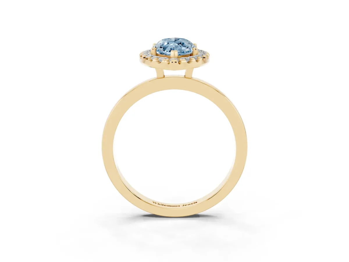 Fancy Blue Marquise Cut Halo Diamond Solitaire with Pavé Band and Four-Prong Setting Yellow gold