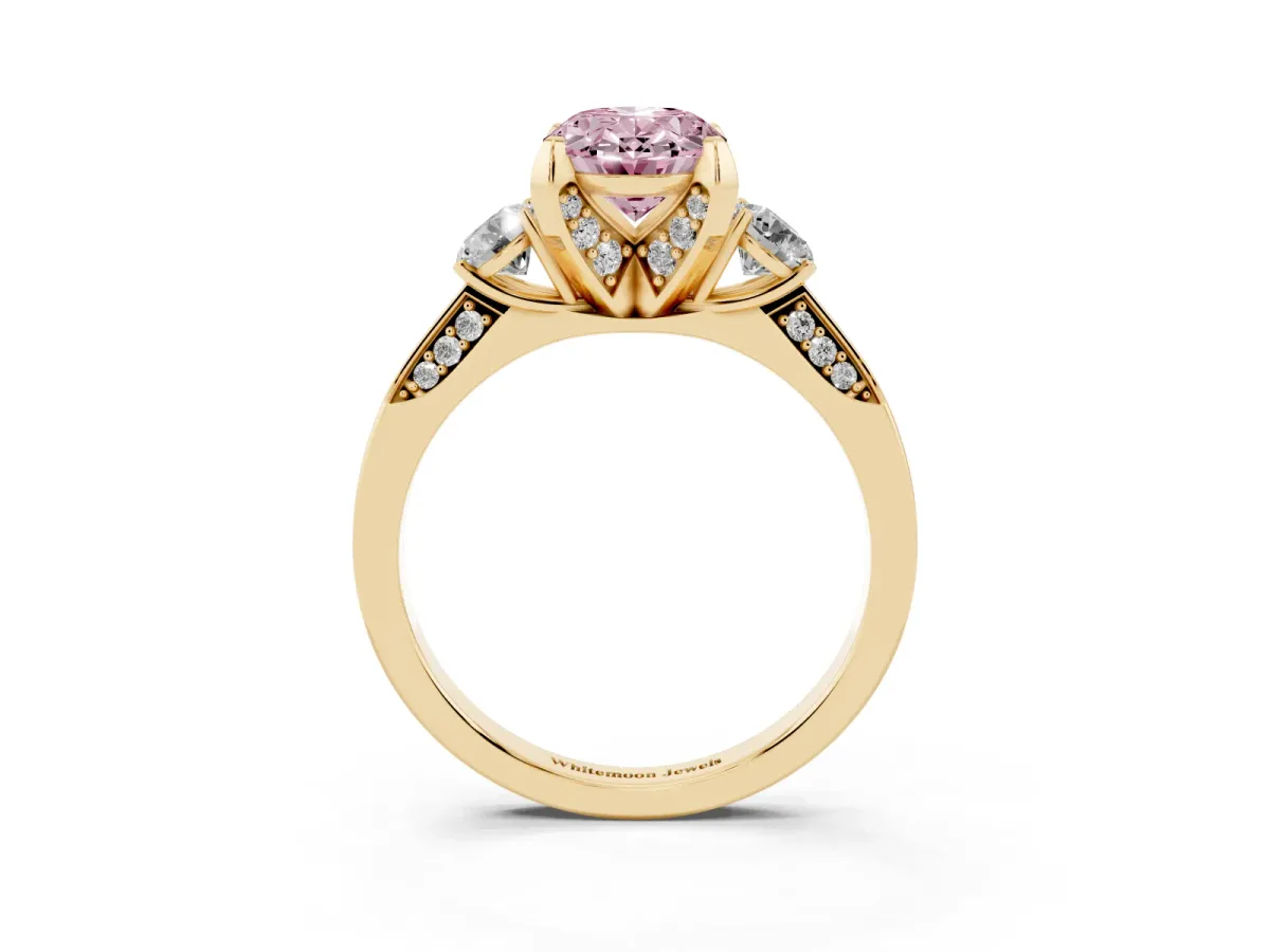 Fancy Pink Oval Cut Brilliant Three-Stone Diamond Ring with Pavé Band and Four-Prong Setting Yellow gold