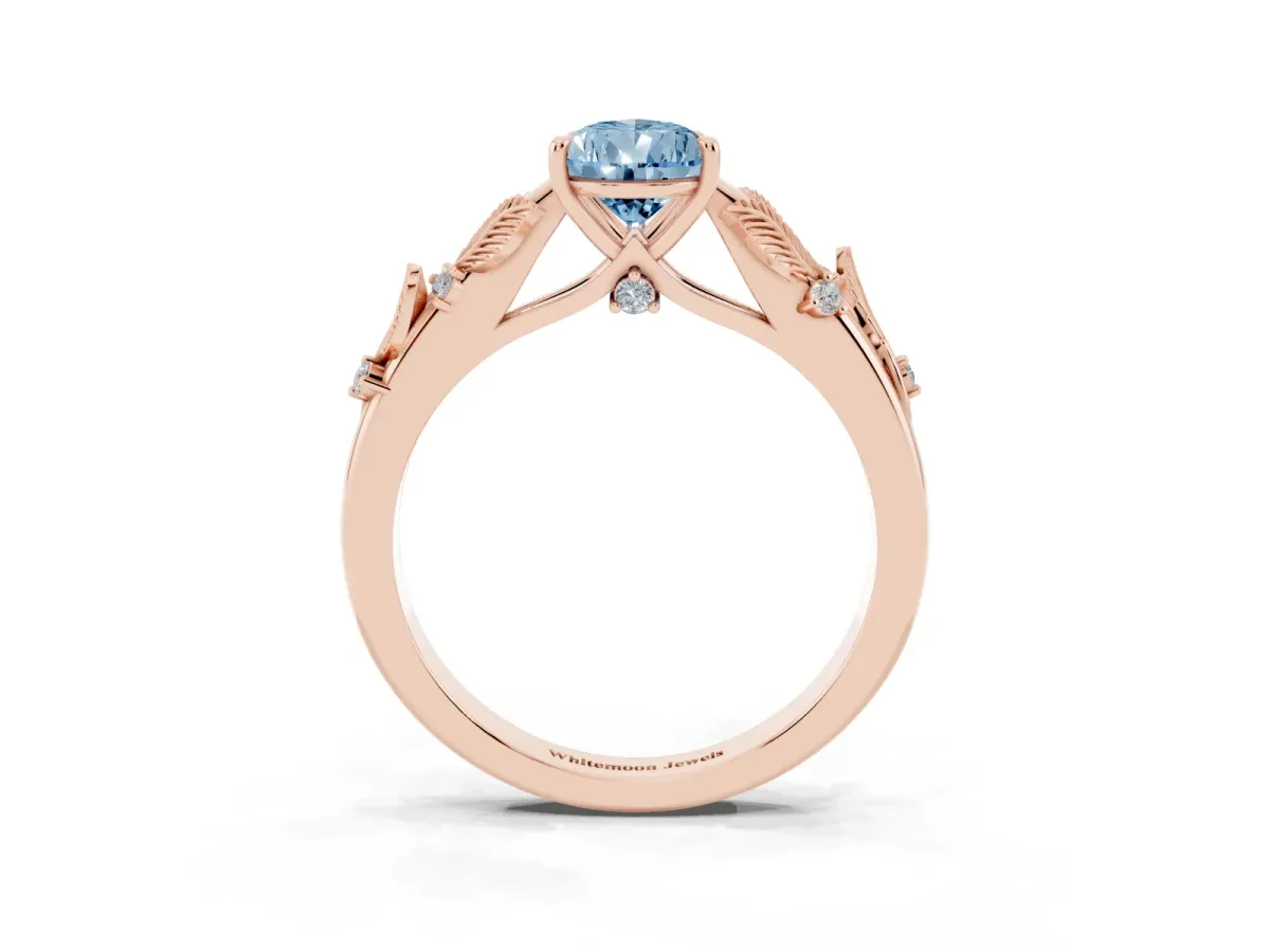 Fancy Blue Pear Cut Diamond Solitaire Ring with Leaf Motif Band and Four-Prong Setting Rose gold