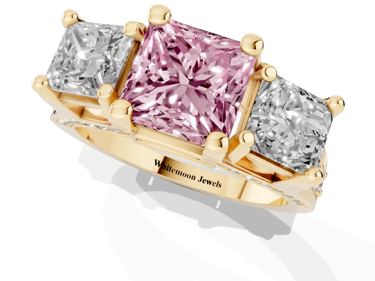 Fancy Pink Princess Cut Diamond Three-Stone Ring with Channel Set Band and Four-Prong Setting Yellow gold