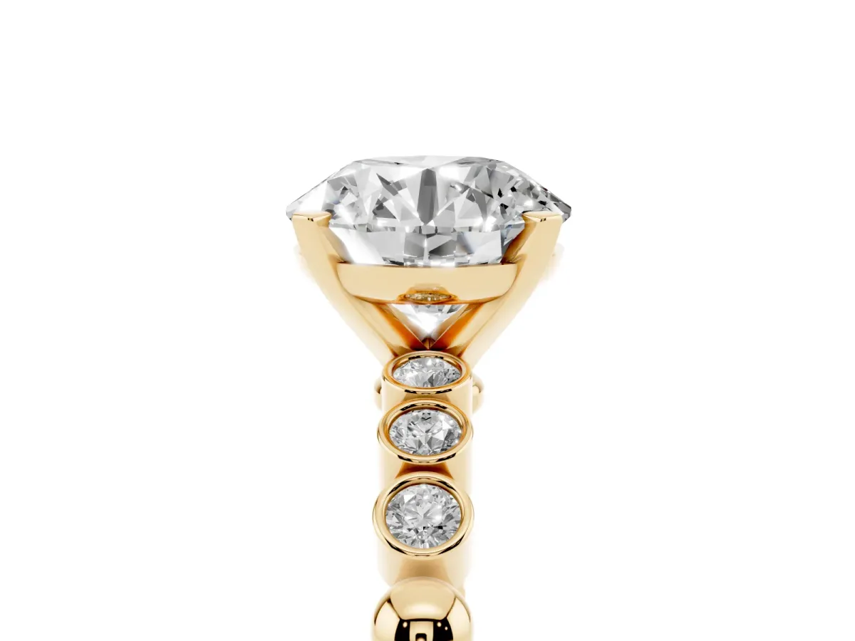 Round Cut Solitaire Bezel Accent Diamond Engagement Ring with Beaded Band and Four-Prong Setting Yellow gold