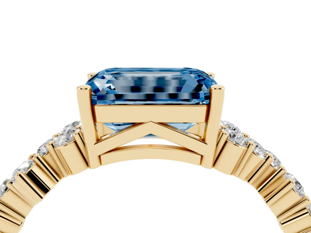 Fancy Blue Emerald Cut Diamond Scattered Round Accent Ring with Prong Setting Yellow gold