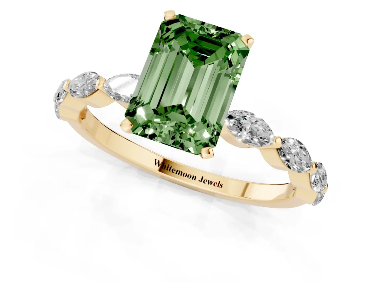 Fancy Green Emerald Cut Diamond Ring with Marquise Side Stones and Prong Setting Yellow gold