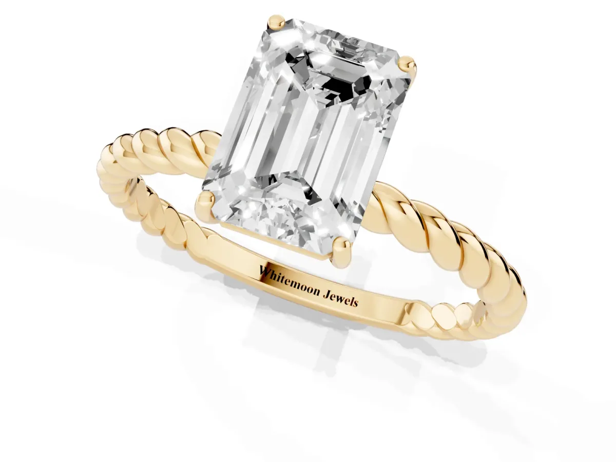 Emerald Cut Solitaire Twist Band Ring with Four-Prong Setting Yellow gold