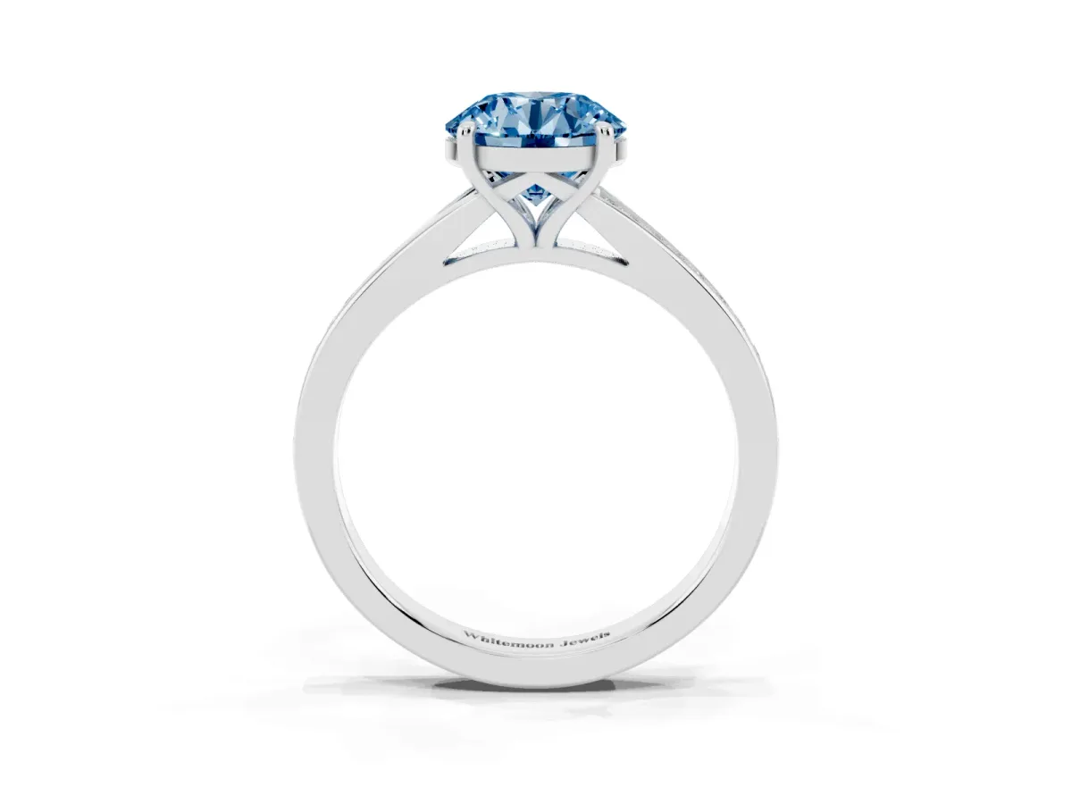 Fancy Blue Round Cut Diamond Solitaire Ring with Pavé Band and Prong Setting Silver