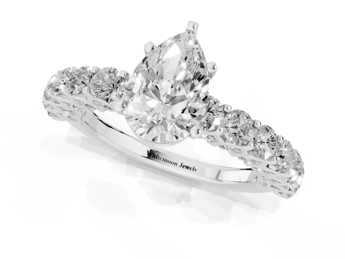Pear Cut Diamond Solitaire Ring with Shared Prong Pavé Band and Four-Prong Setting Silver