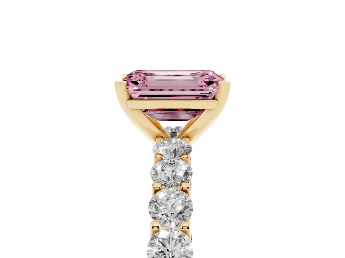 Fancy Pink Emerald Cut Diamond Solitaire Ring with Shared Prong Pavé Band and Four-Prong Setting Yellow gold