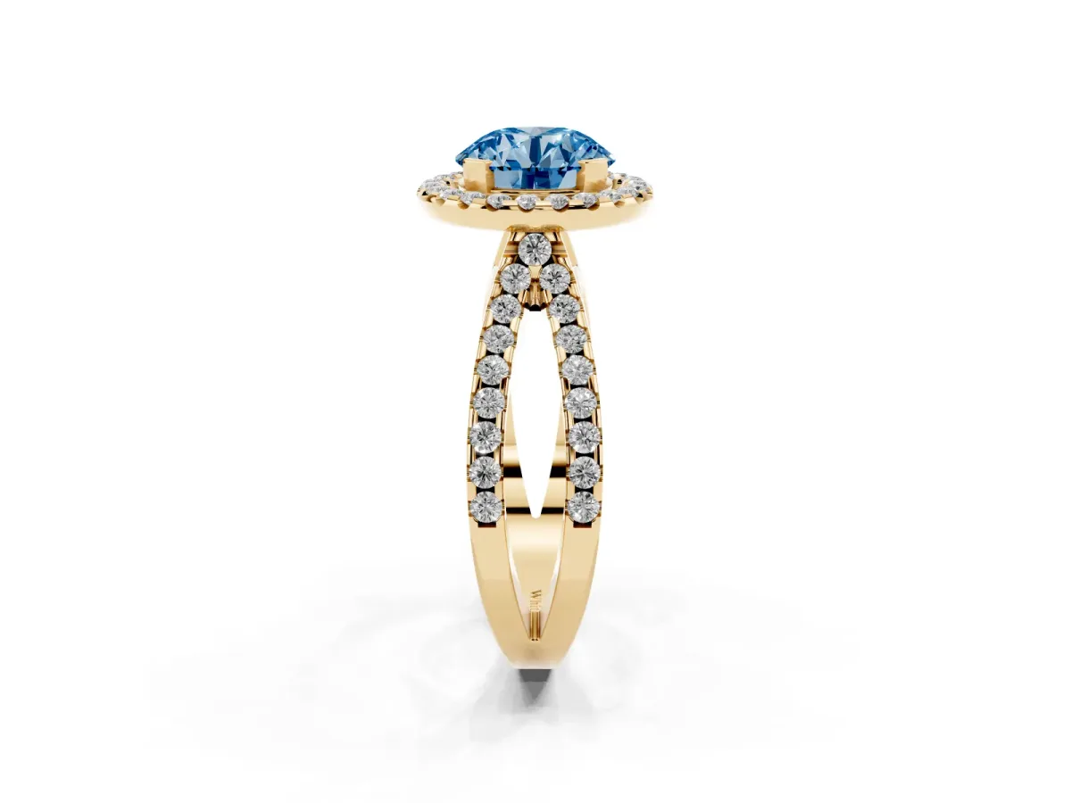 Fancy Blue Round Cut Diamond Halo Ring with Split Shank Pavé Band and Prong Setting Yellow gold
