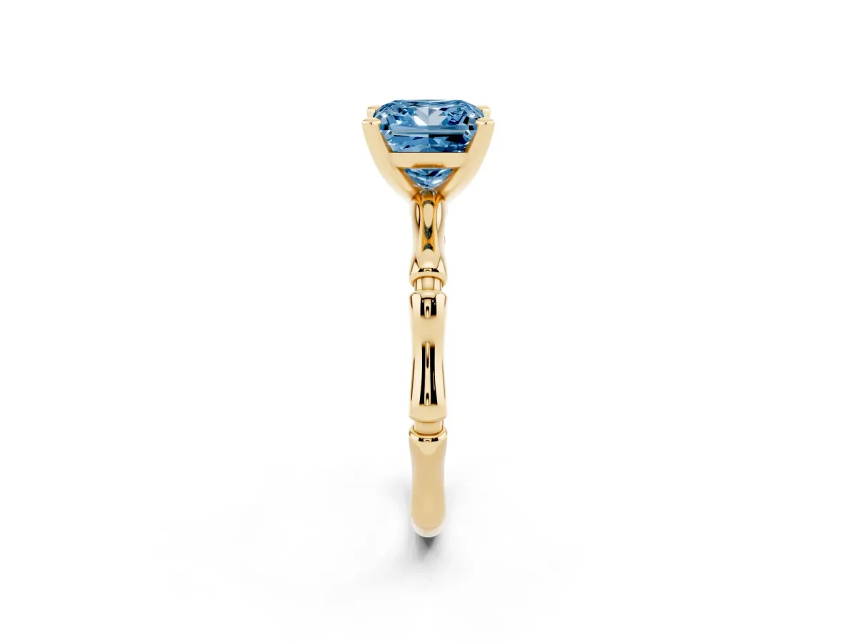 Fancy Blue Princess Cut Solitaire Diamond Ring with Bamboo Band and Four-Prong Setting Yellow gold