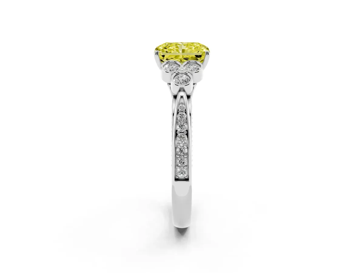 Fancy Yellow Radiant Cut Cut Diamond Engagement Ring with Bezel Set Round Side Stones and Prong Setting Platinum